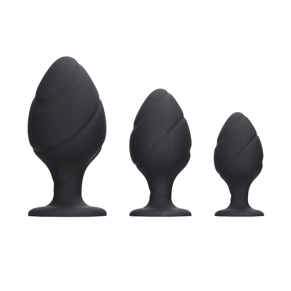 Black silicone butt plug set, three sizes.