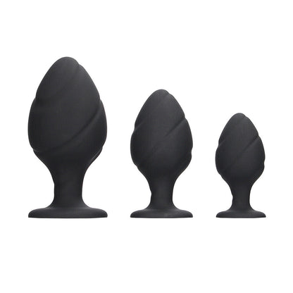Black silicone butt plug set, three sizes.