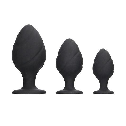 Black silicone butt plug set, three sizes.