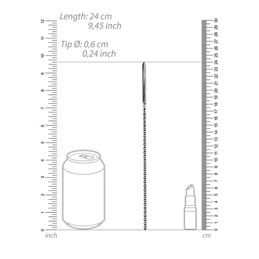 Bumpy stainless steel urethral sound next to can and lipstick for scale.