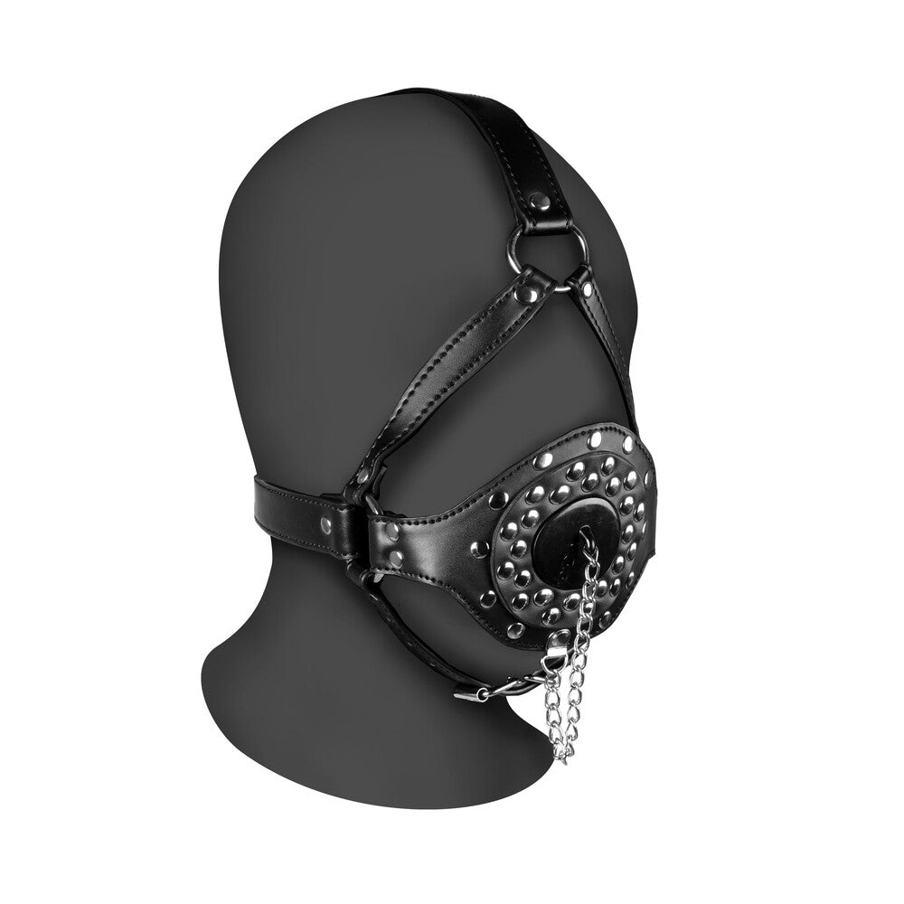 Leather open mouth gag with plug stopper and metal detailing.