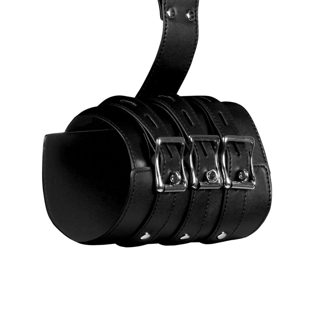 Black leather arm restraints with adjustable buckles.

