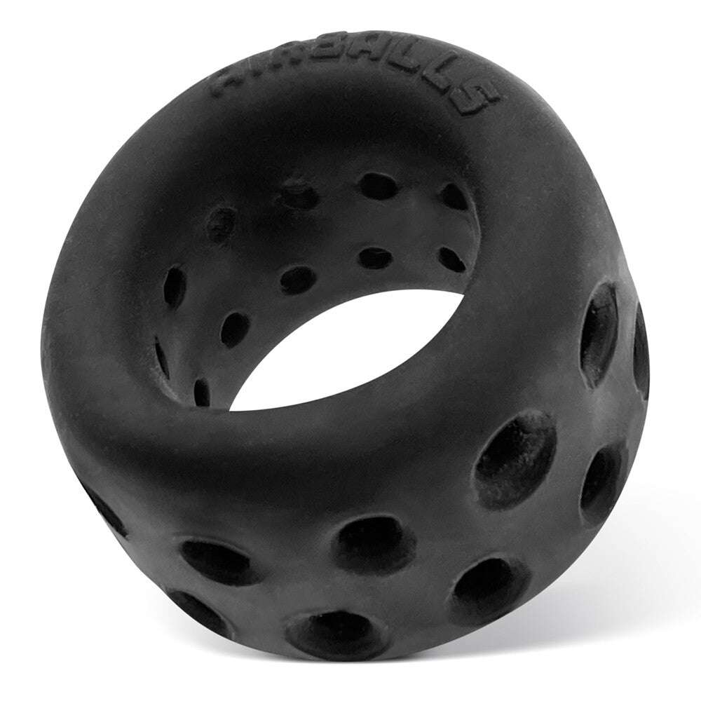 Black, porous AirLite ball stretcher from Oxballs for enhanced sensations.