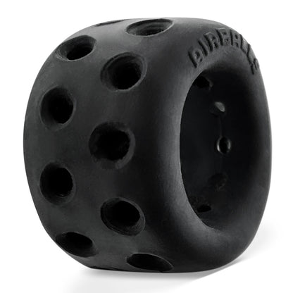 Black, porous Oxballs AirLite ball stretcher for comfortable, breathable cock and ball enhancement.
