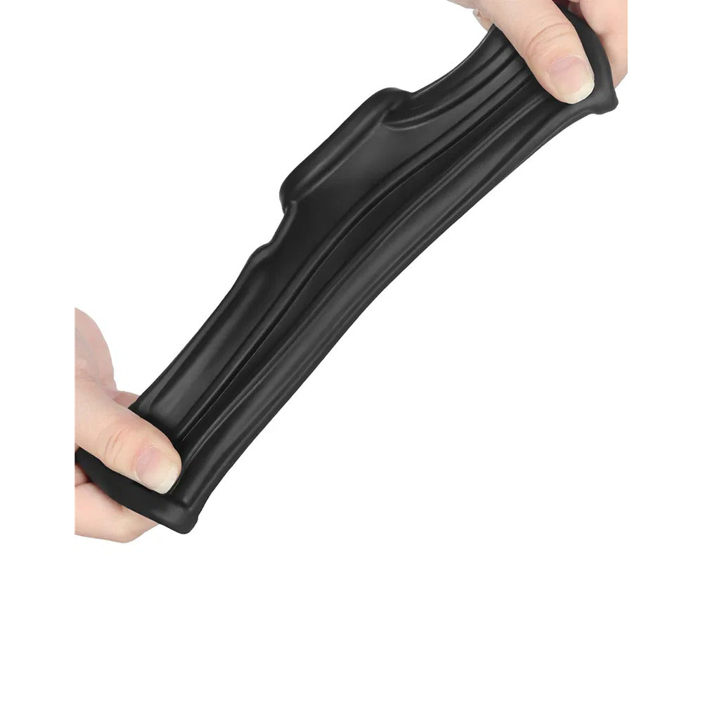 Black Lovetoy sleeve held and stretched between two hands.