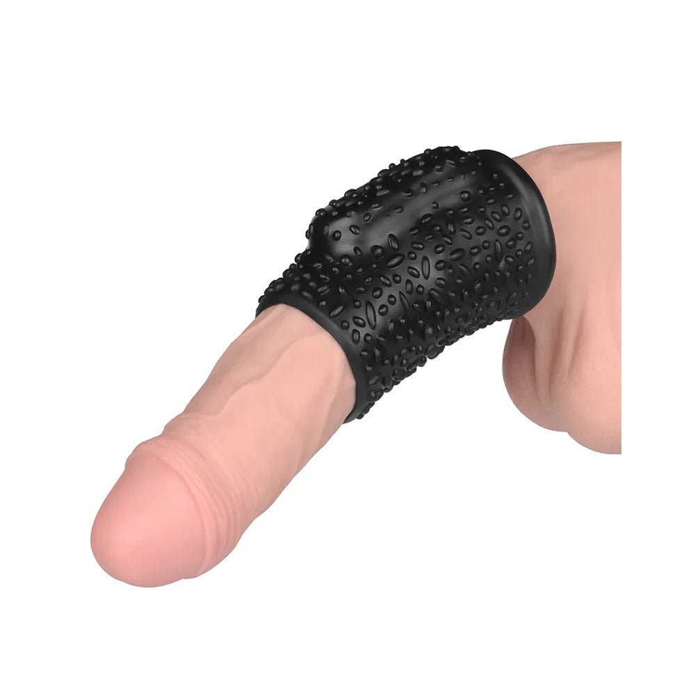 Lovetoy Drip vibrating penis sleeve, adding thrilling sensation. Black, textured sleeve on a penis, for extra pleasure.