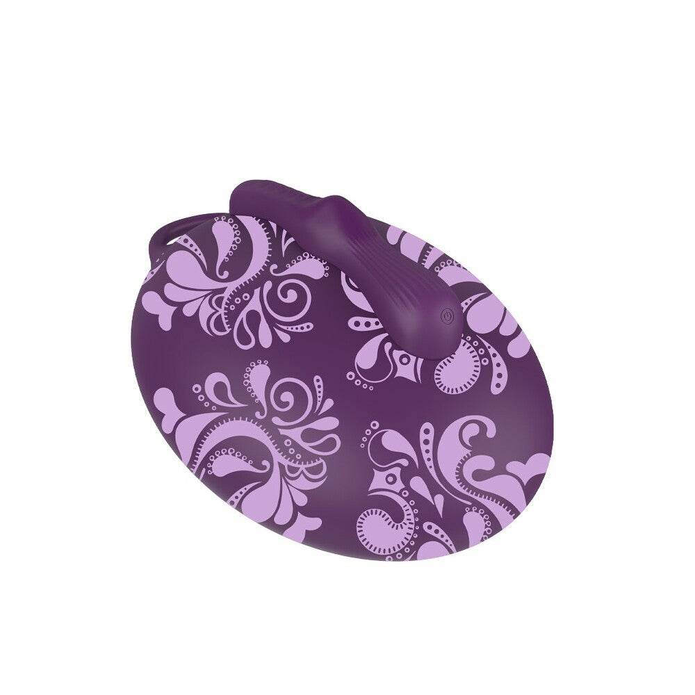 Indulge your desires with this playfully elegant purple sit-on vibrator, adorned with sensual, empowering floral patterns.