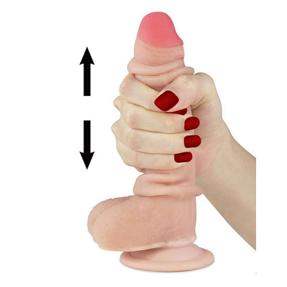 Lovetoy Sliding Skin Dildo, shown with hand demonstrating its sliding movement. Nude with pink tip.