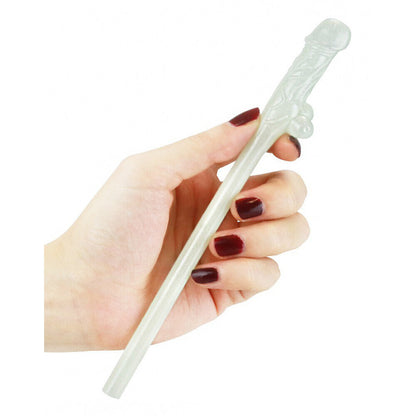 Cheeky willy-shaped glow-in-the-dark novelty drinking straw being held.

