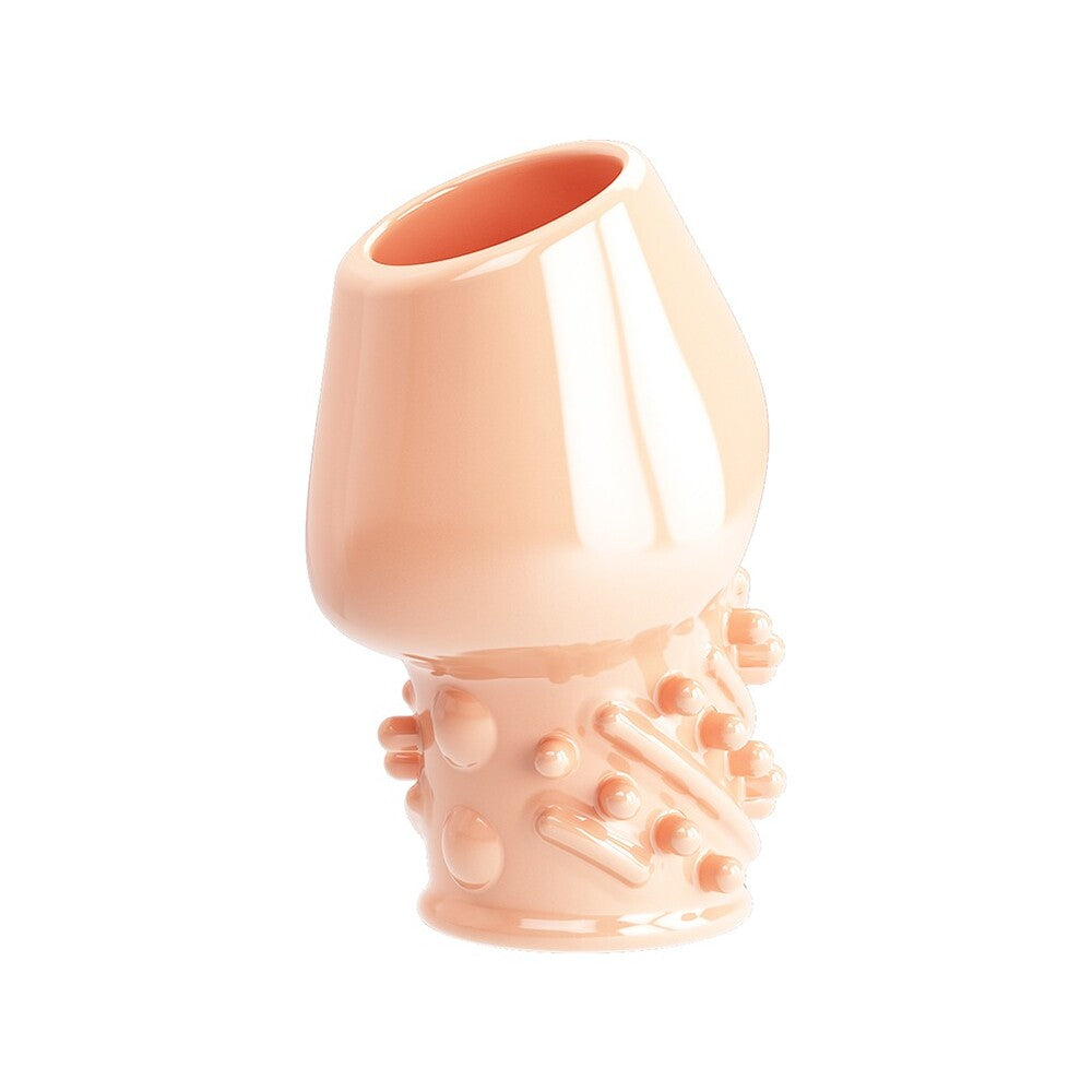 Flesh-toned penis sleeve with textured details for enhanced pleasure.