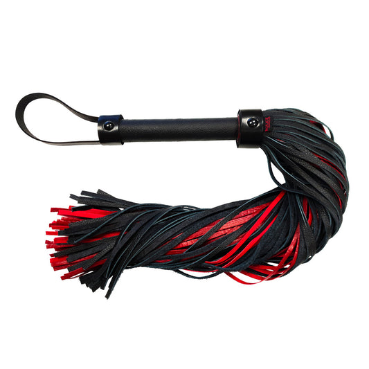 Leather croc print flogger from Rouge Garments, featuring black and red strands and a sleek handle. Embrace your playful side.

