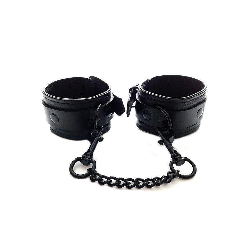 Rouge Garments black faux leather wrist cuffs with chain.