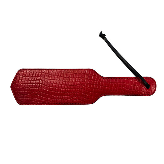 Rouge Garments red croc-print leather paddle with black loop.