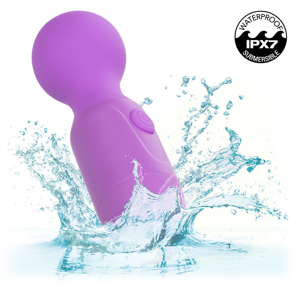 Purple waterproof wand massager in water.