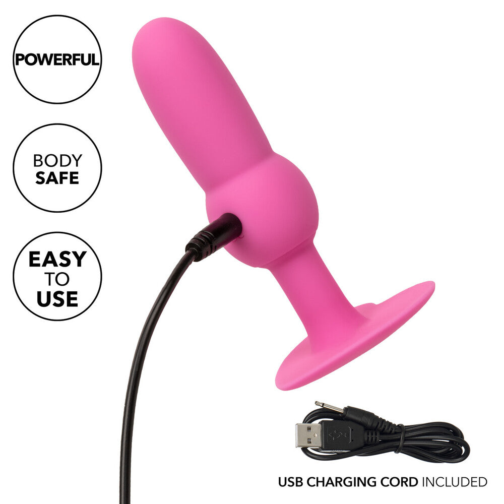 Pink vibrating beaded probe with USB charging cable for pleasure.