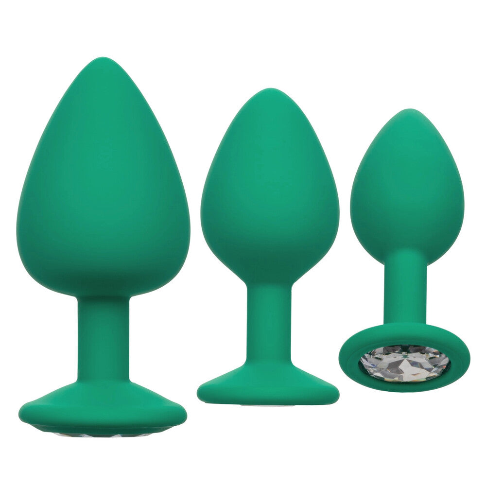 Emerald seduction: three jewelled butt plugs for a touch of cheeky pleasure.