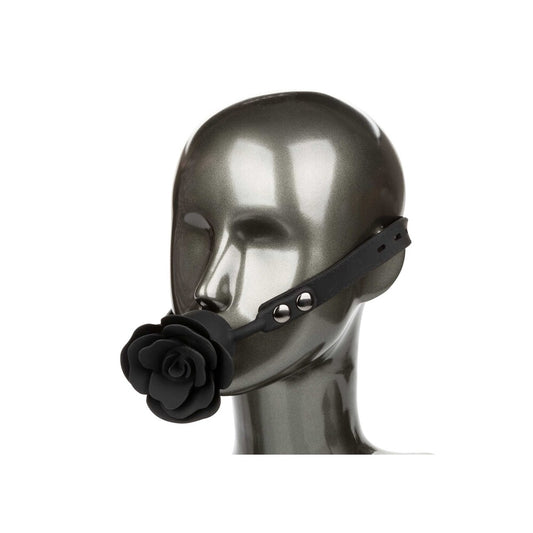 Black rose gag on mannequin's head.
