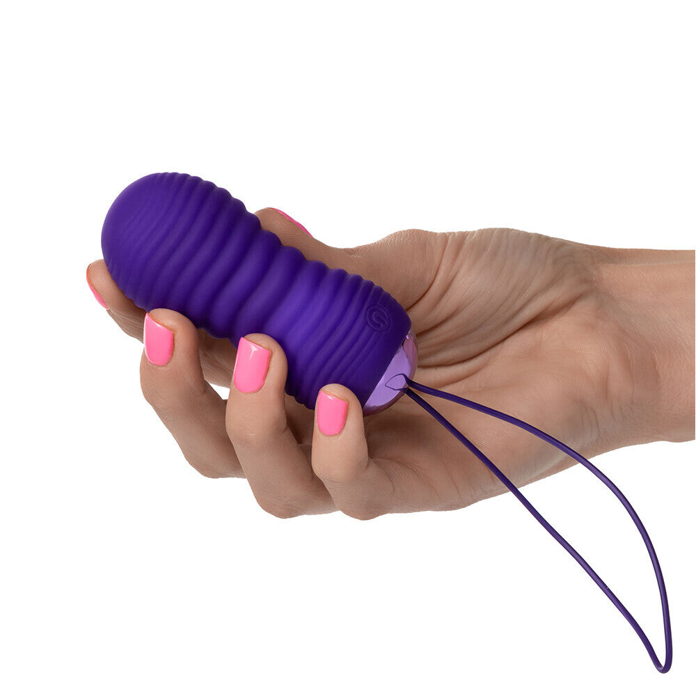 Purple THRUSTME bullet vibe in a hand