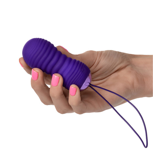 Purple THRUSTME bullet vibe in a hand