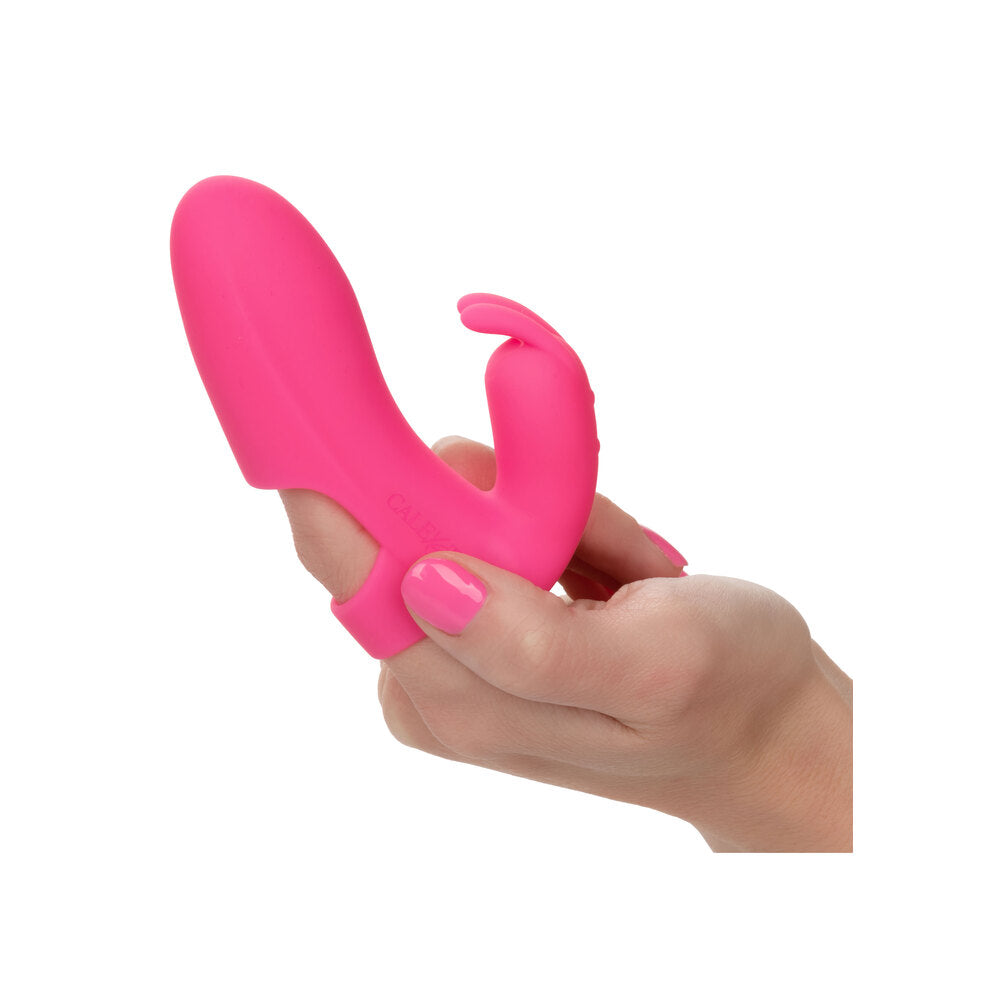 Pink rabbit vibrator worn on finger.