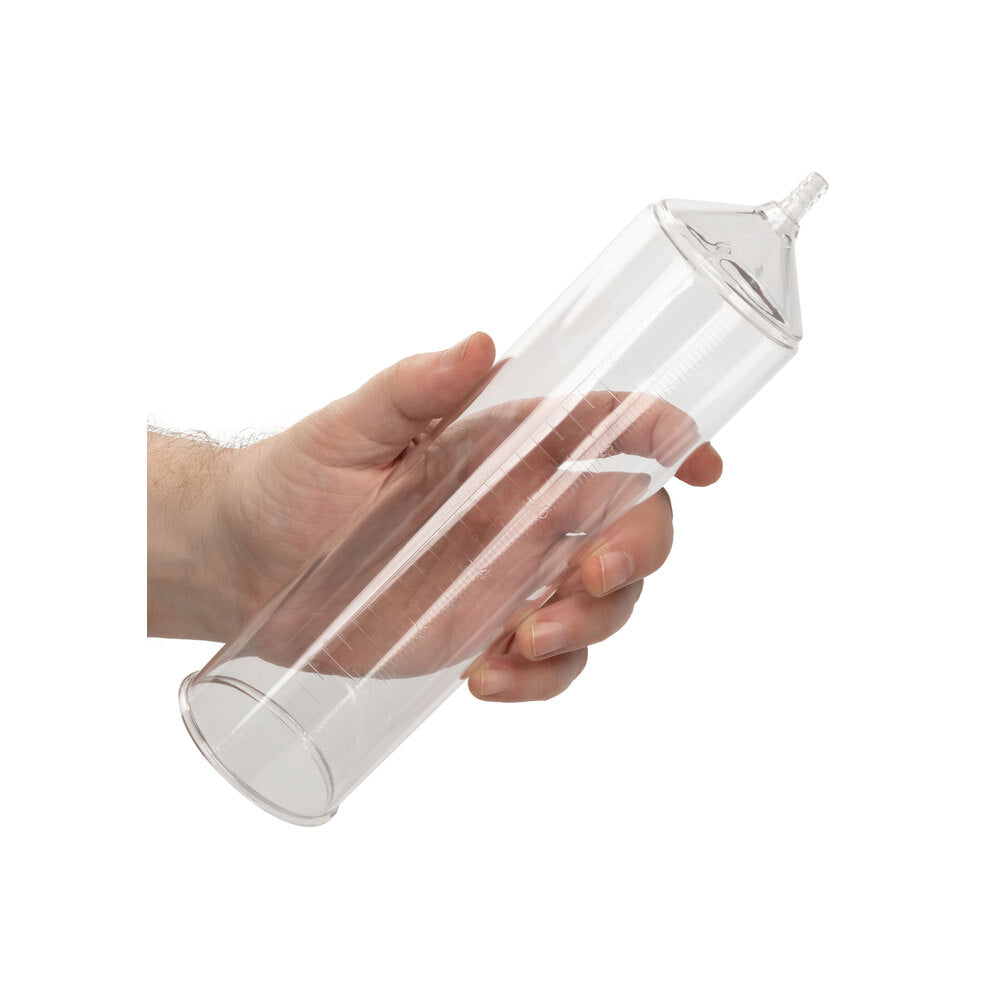 Clear cylinder pump held in hand, promising a confident silhouette.
