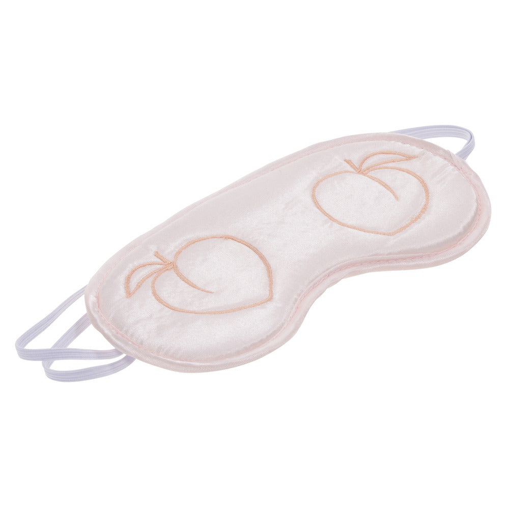 Blush pink satin blindfold with cheeky peach embroidery.