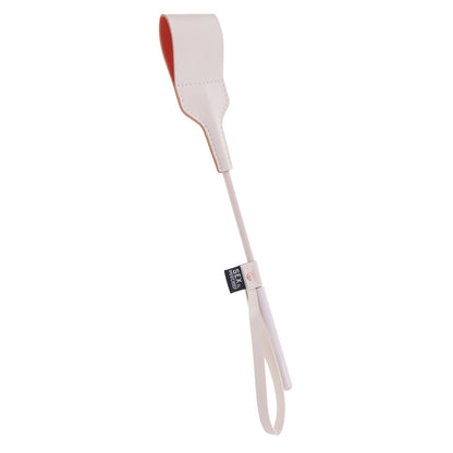 Ivory riding crop for playful fun.