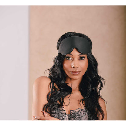 Sensual woman wearing a Sportsheets Blackout Blindfold.