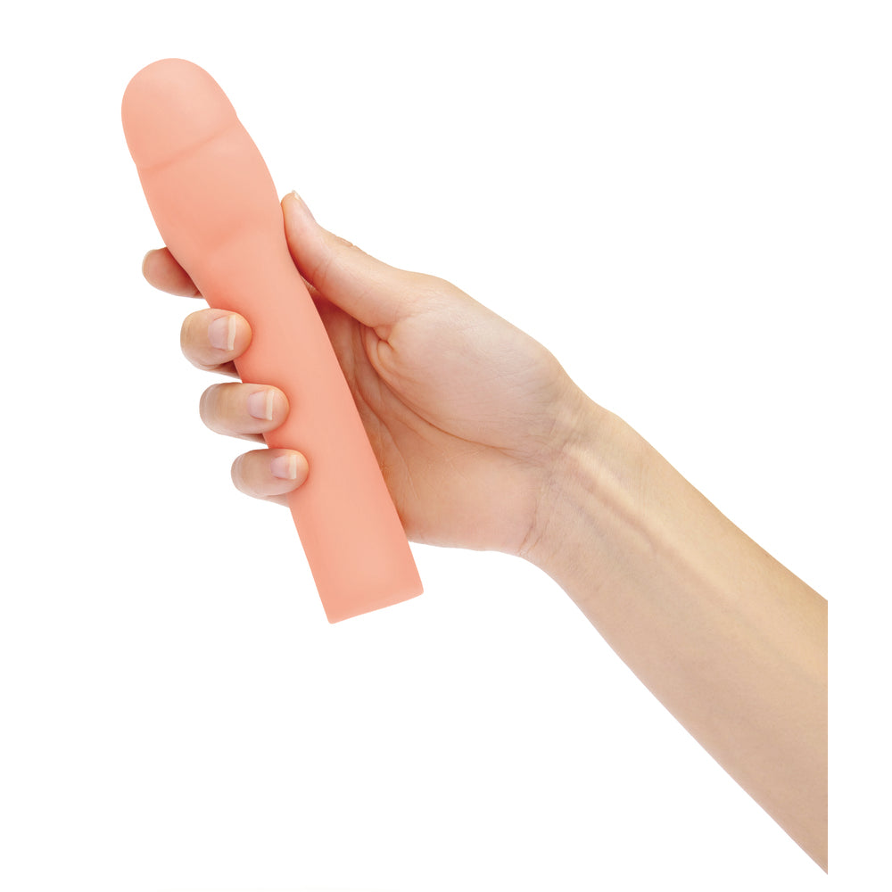 Size Up penis extender held in hand.